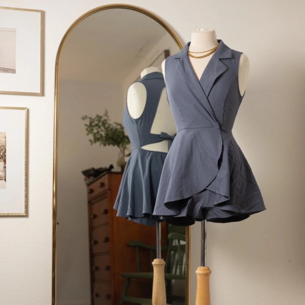 Privy NWOT wrap style romper with open back. Size small